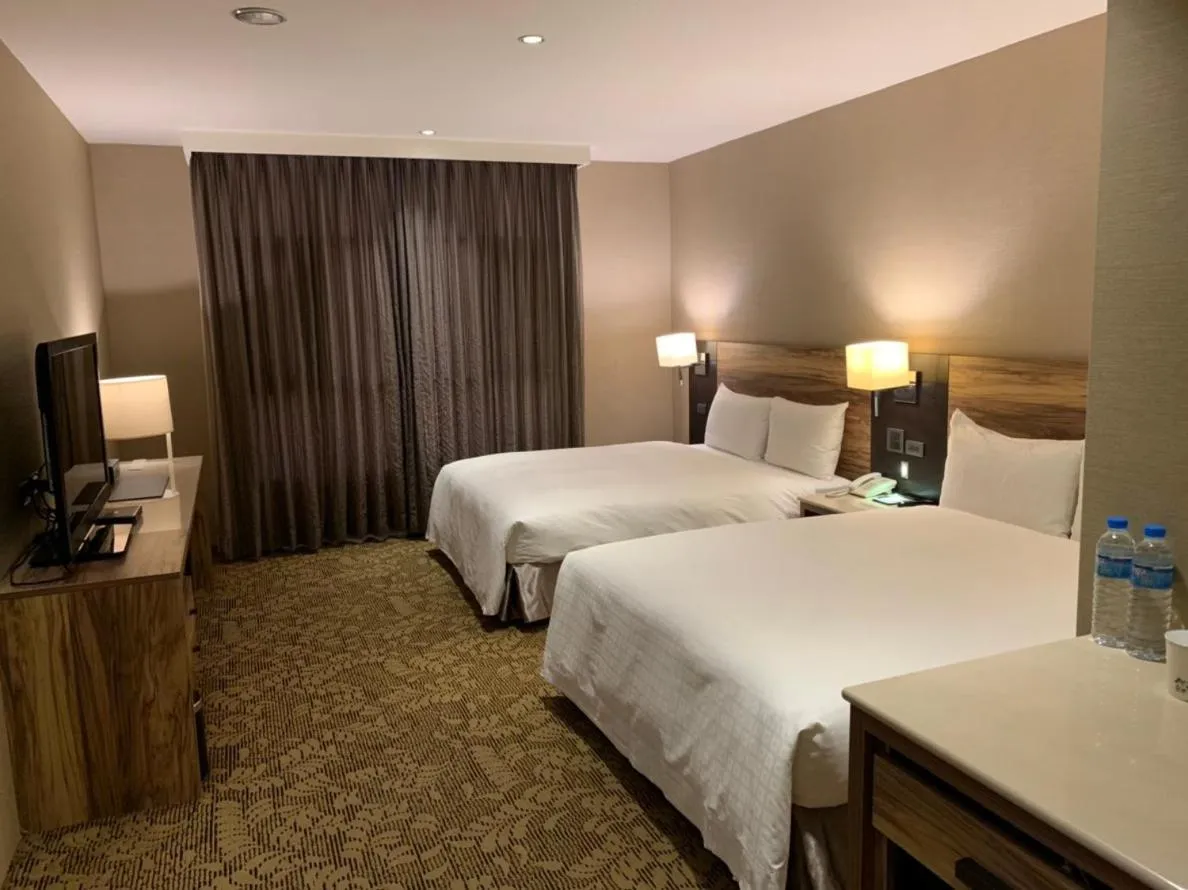 Bed in Chiayi Oriental Pearl International Hotel