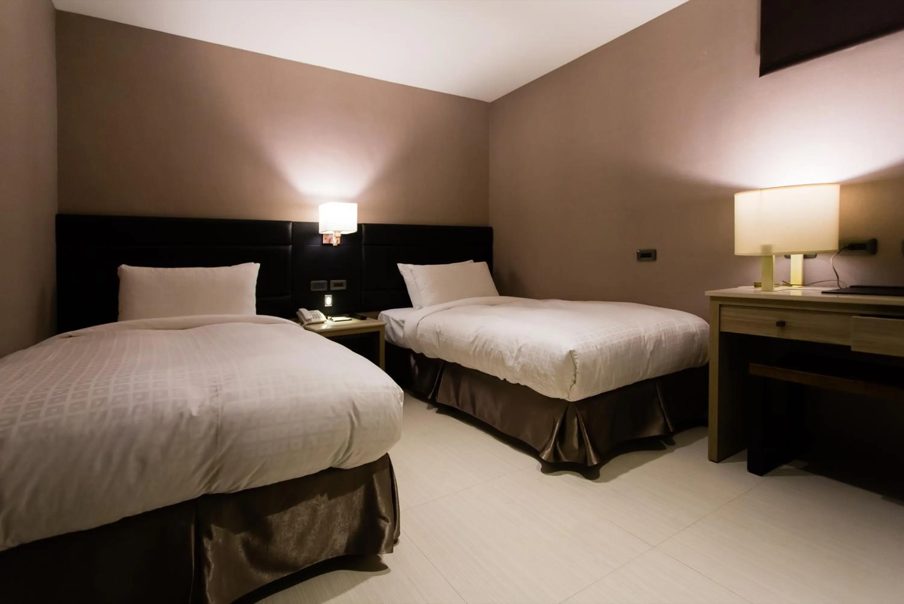 Bed in Chiayi Oriental Pearl International Hotel