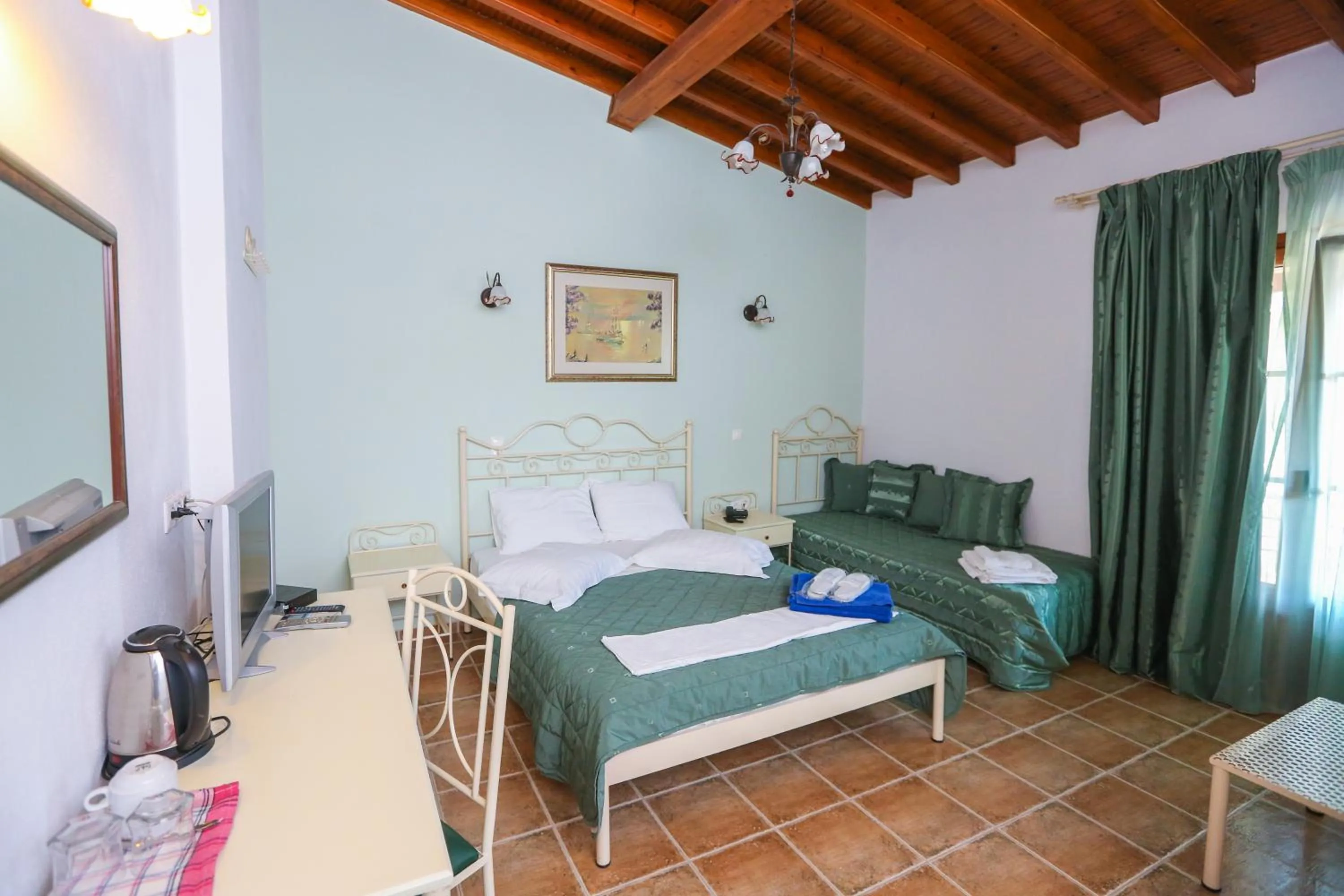 Bed in Skiathos Island Suites