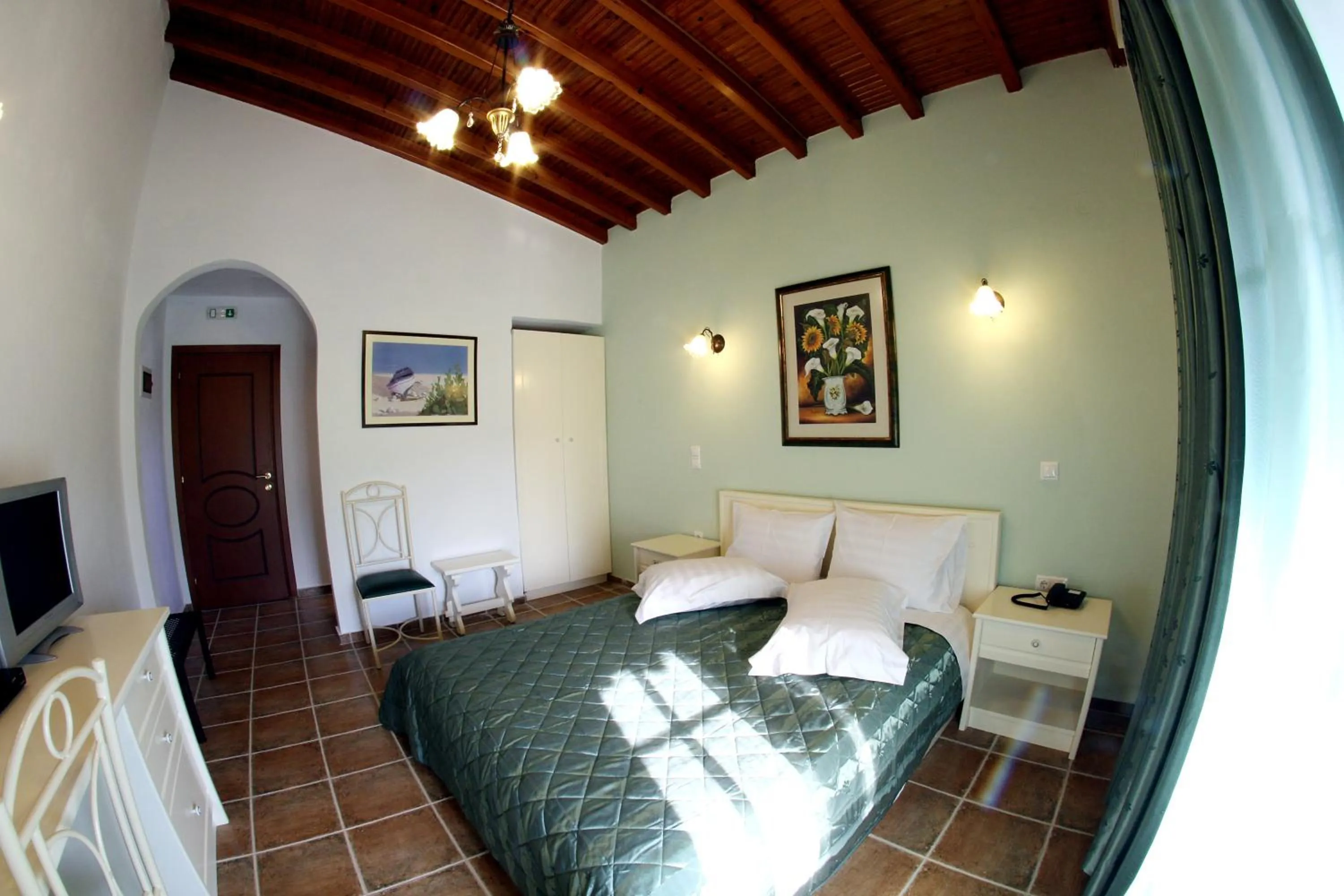 Bed in Skiathos Island Suites