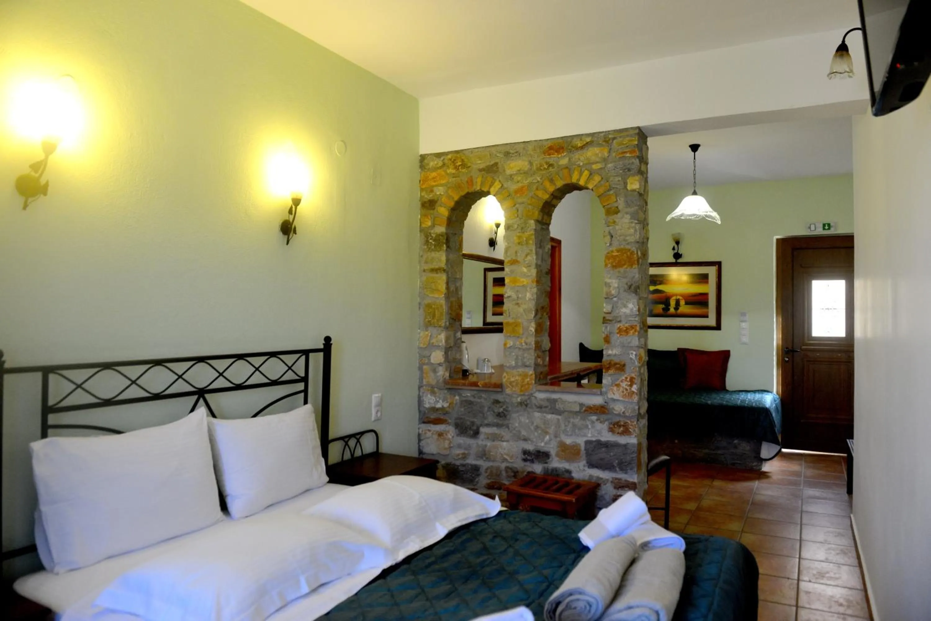 Bed in Skiathos Island Suites