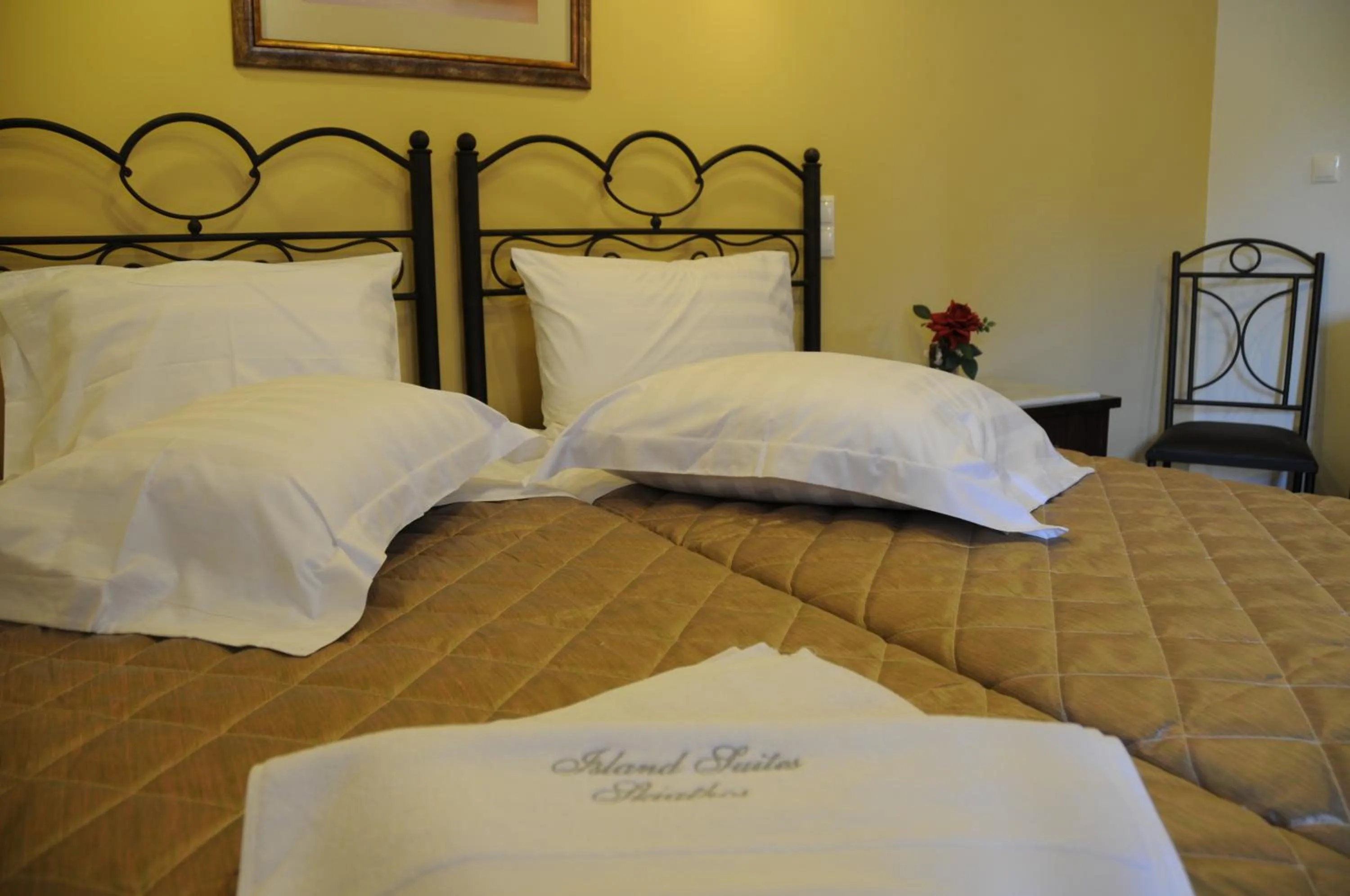 Bed in Skiathos Island Suites