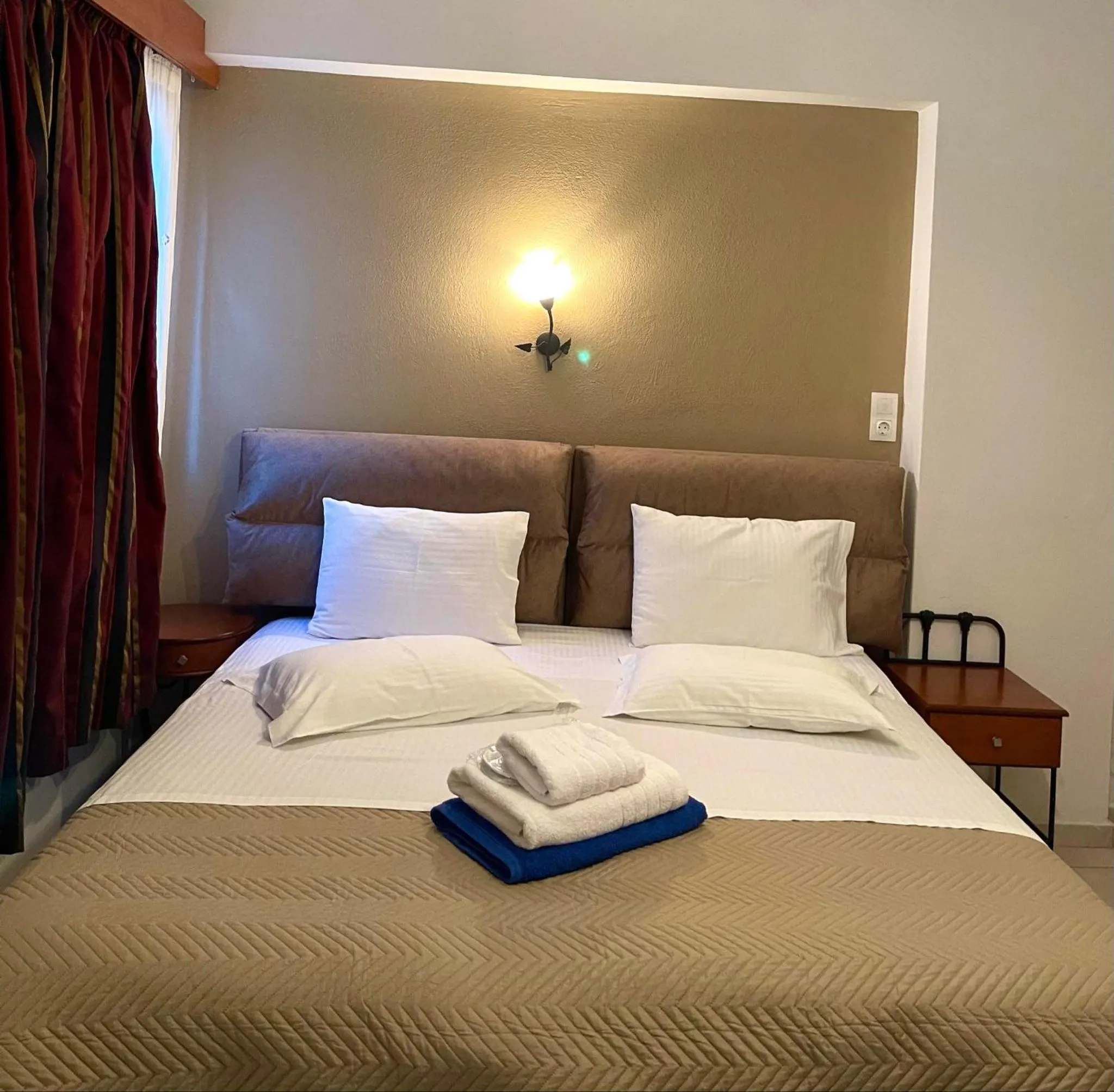 Bed in Skiathos Island Suites