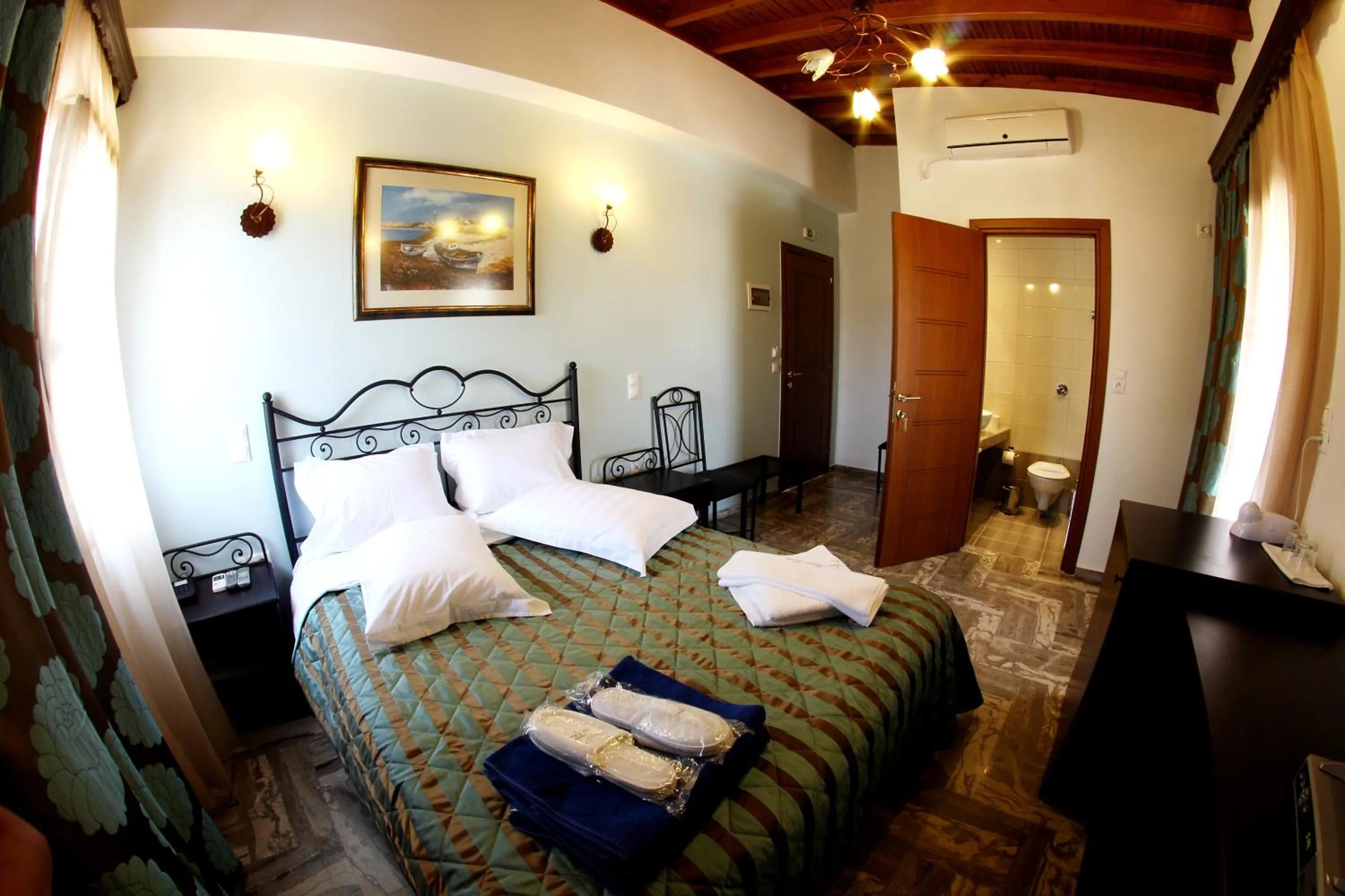 Bed in Skiathos Island Suites