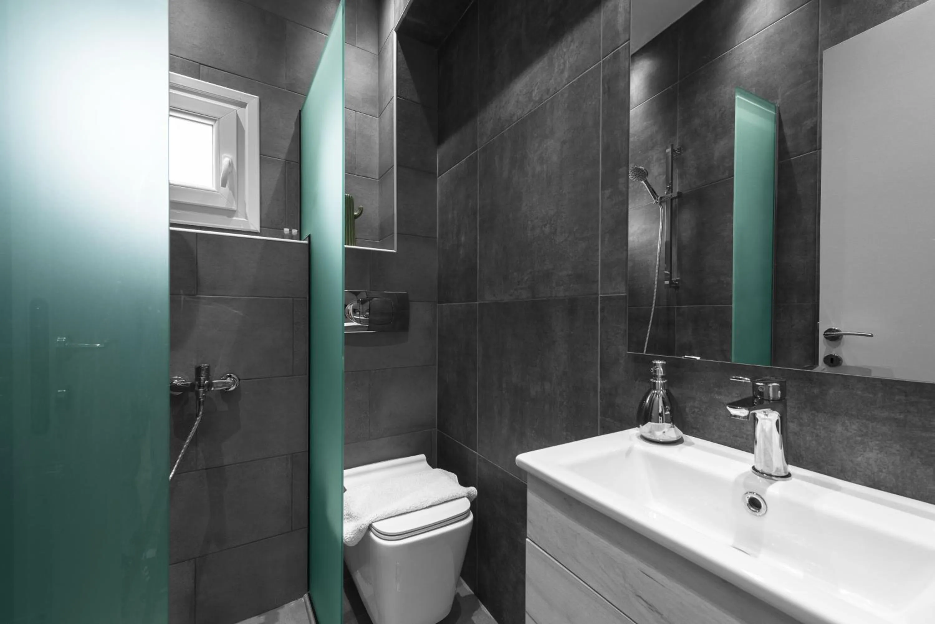 Shower in DeniZen Boutique Apartments, Nilie Hospitality MGMT