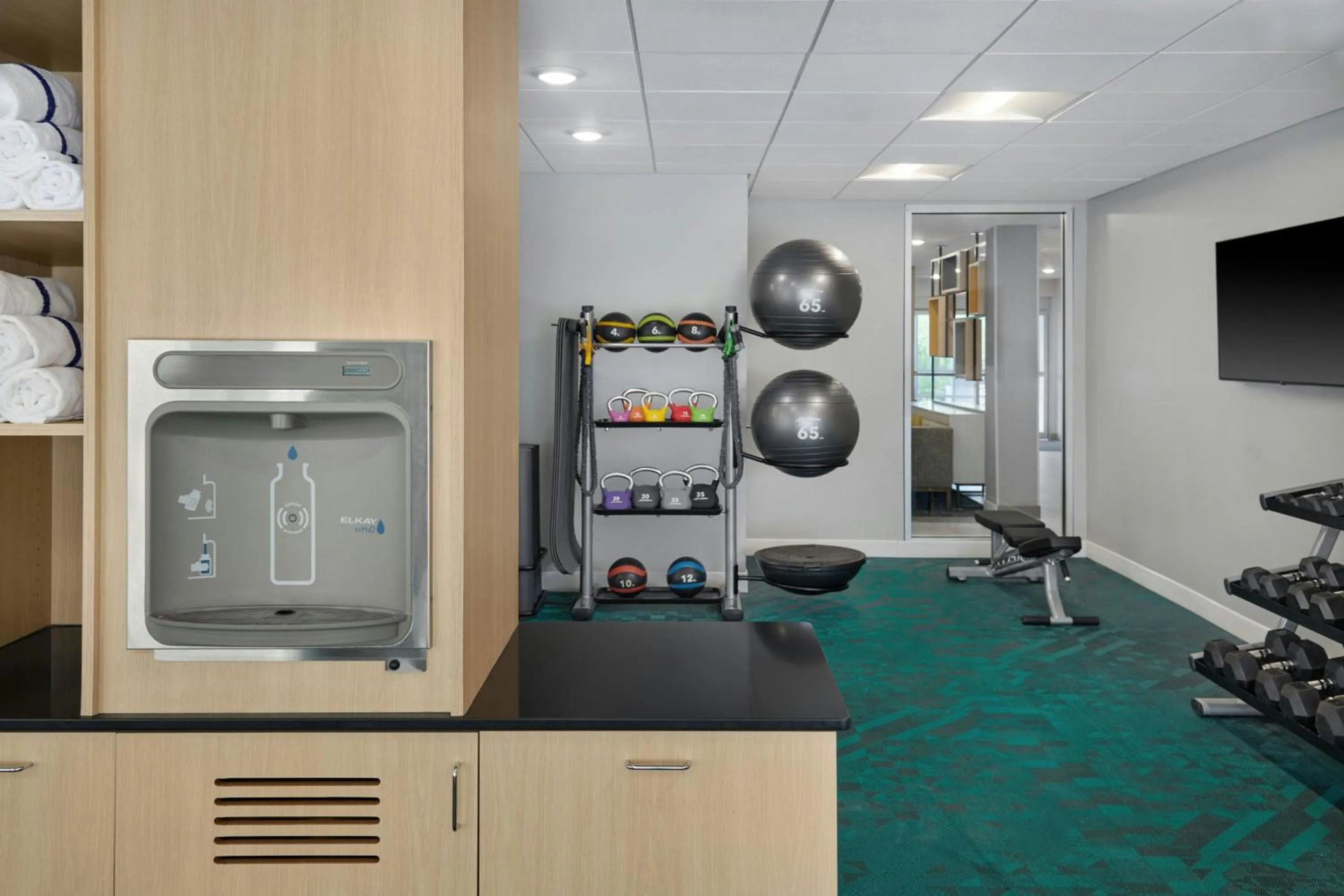 Fitness centre/facilities in TownePlace Suites by Marriott Lansing North
