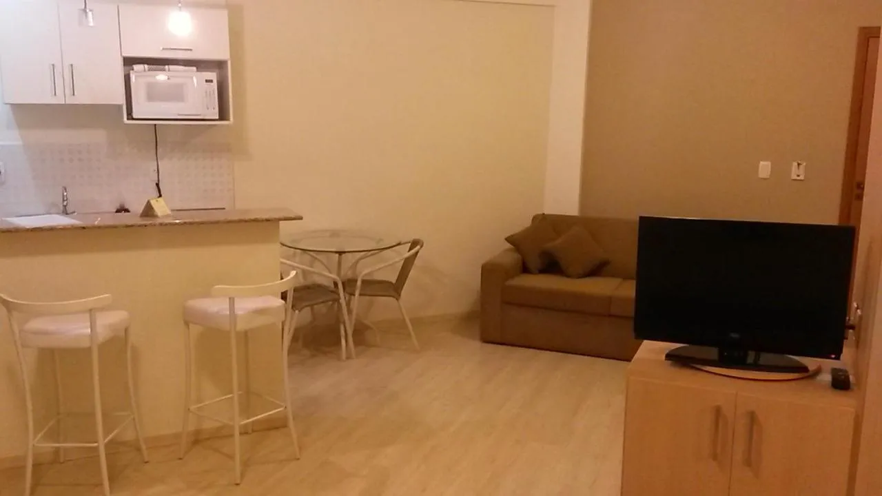 Communal lounge/ TV room in Itajubá Flat Hotel
