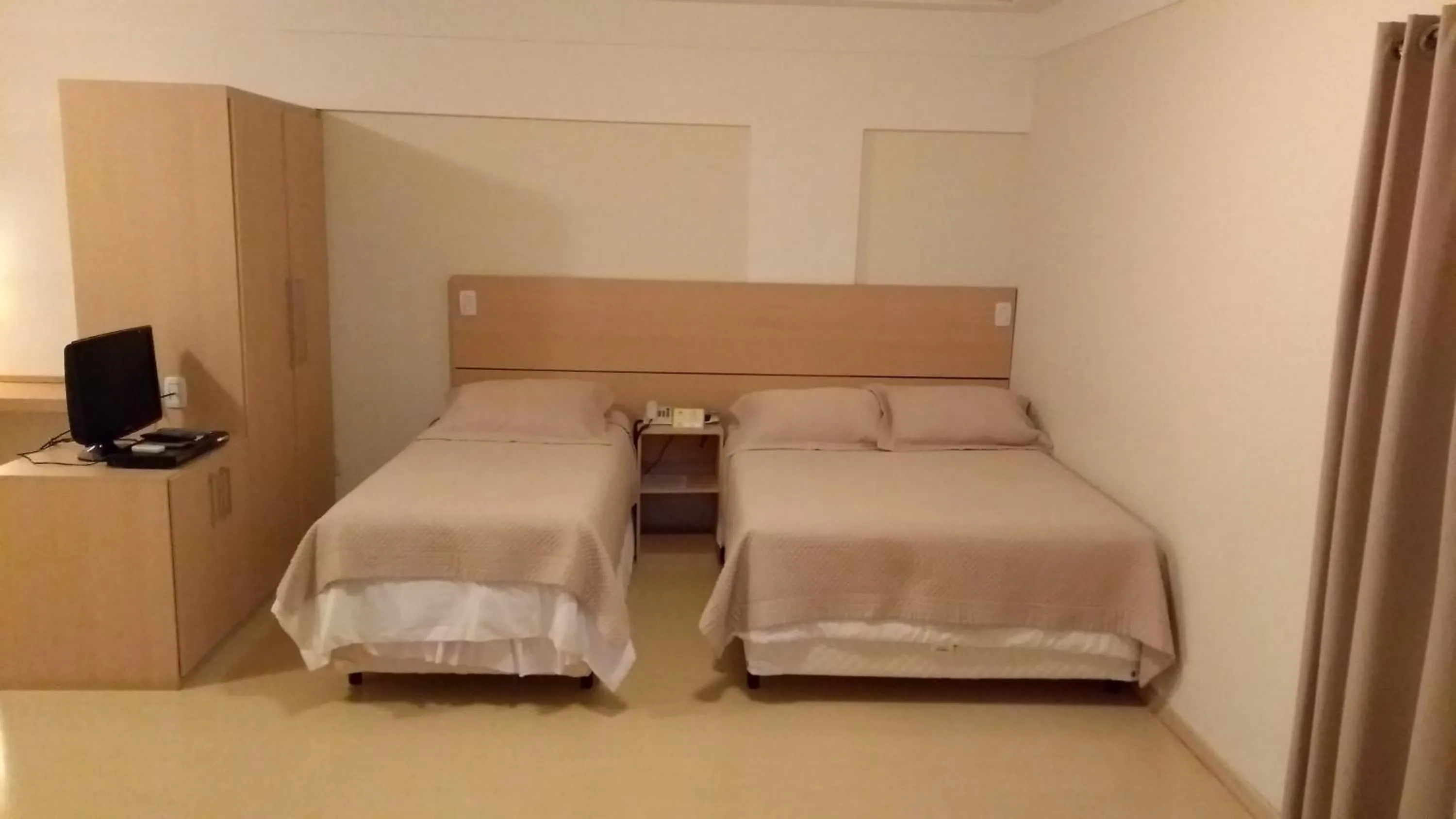 Bed in Itajubá Flat Hotel