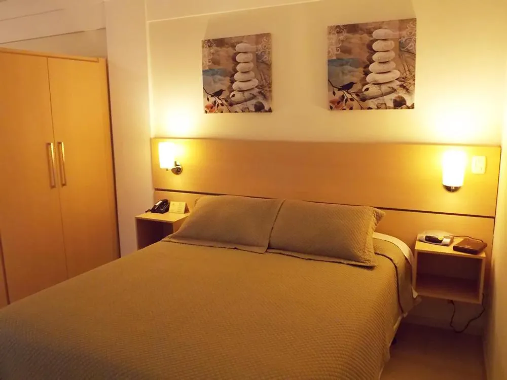 Bed in Itajubá Flat Hotel