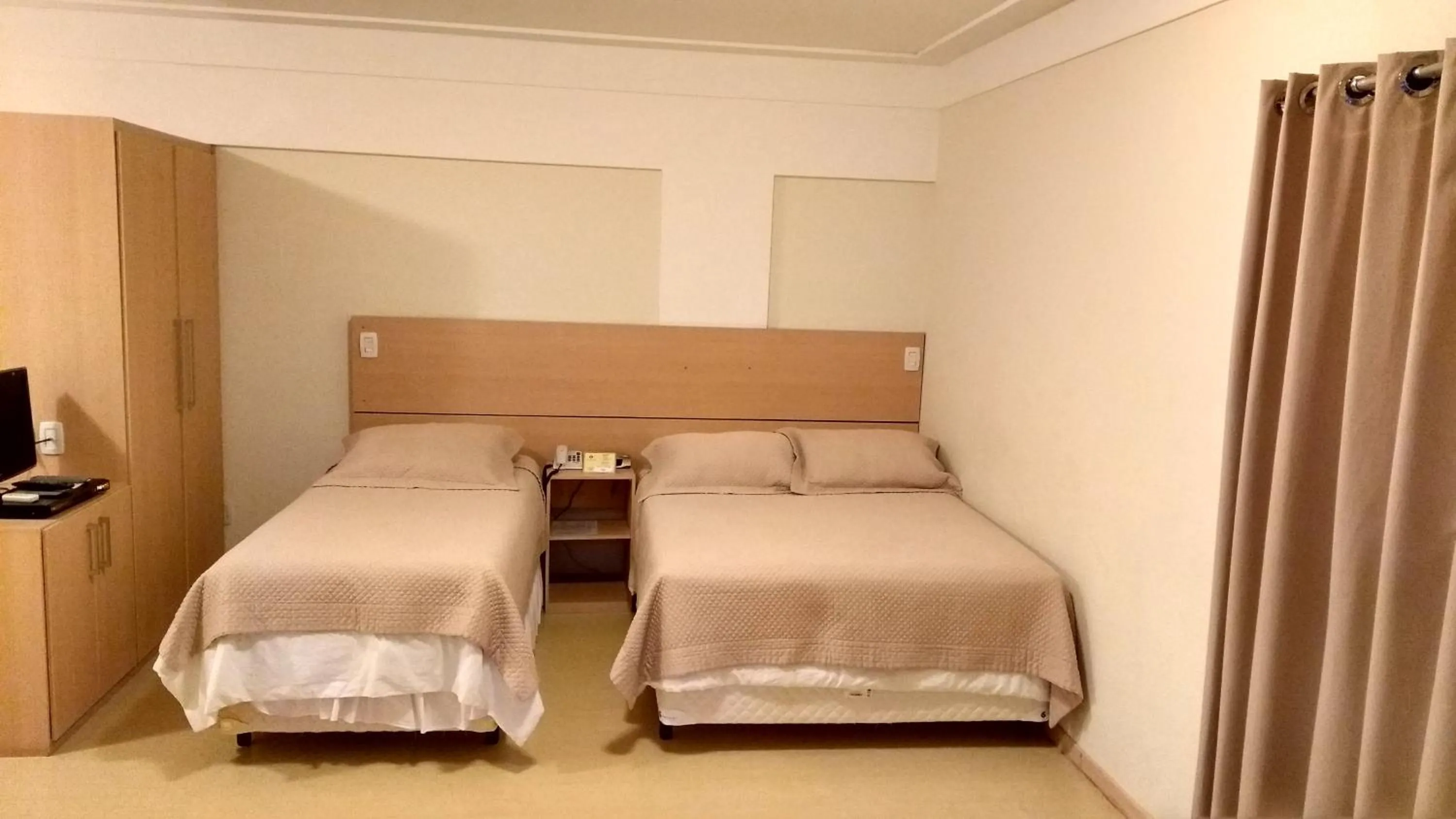 Bed in Itajubá Flat Hotel