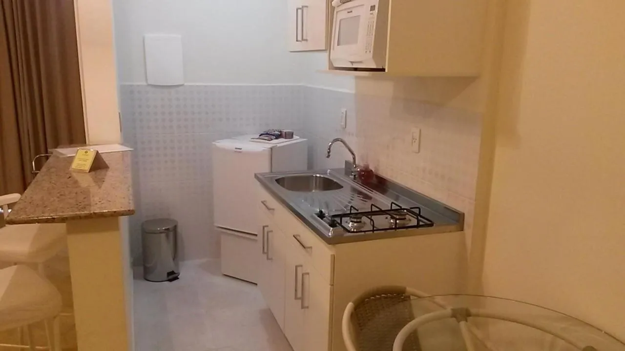 Kitchen or kitchenette in Itajubá Flat Hotel