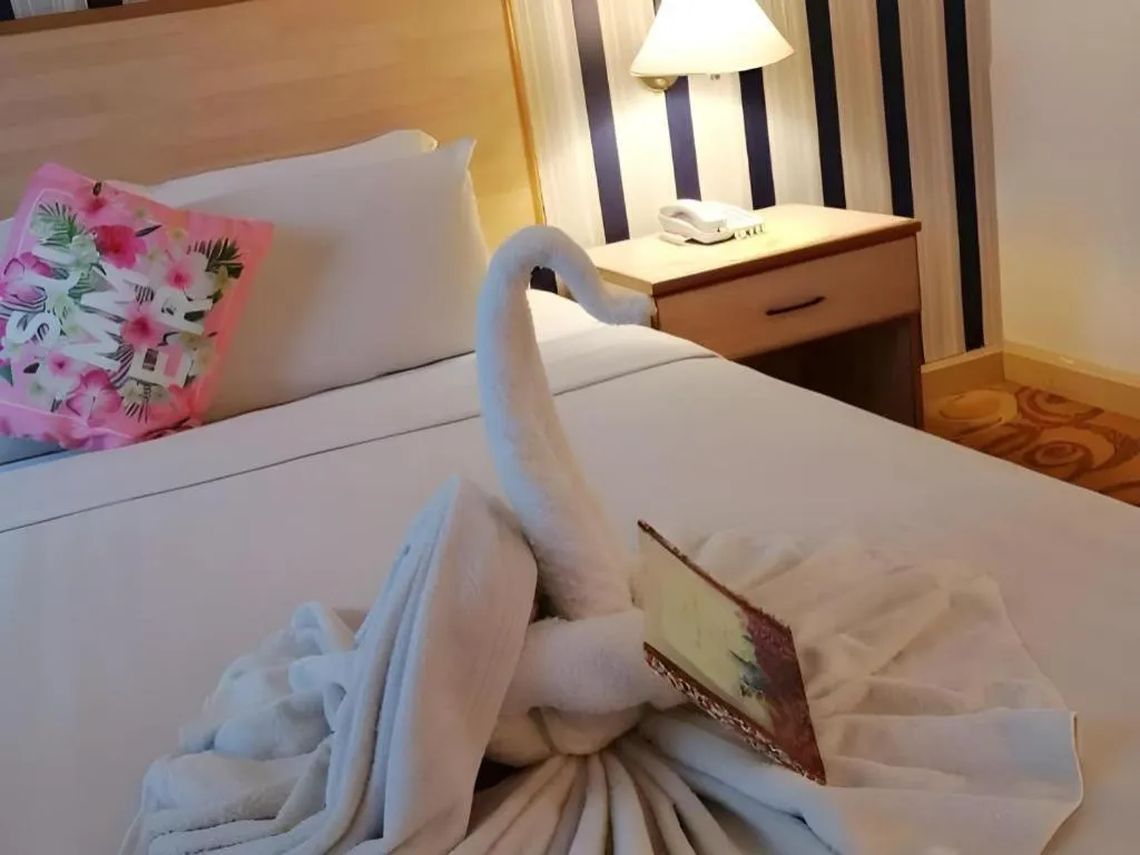 Bed in The Orchid Hotel