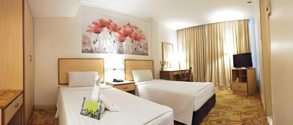 Bed in The Orchid Hotel