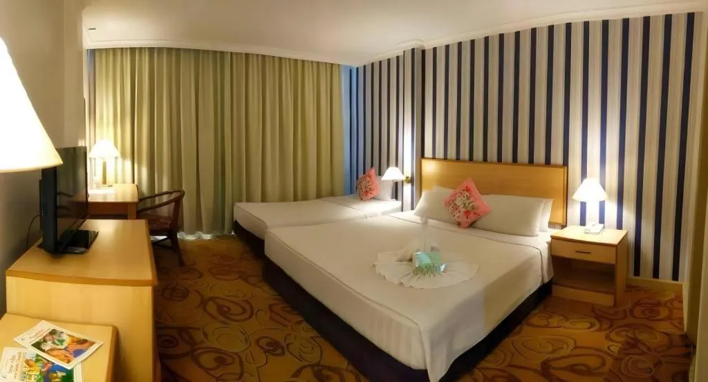 Bed in The Orchid Hotel