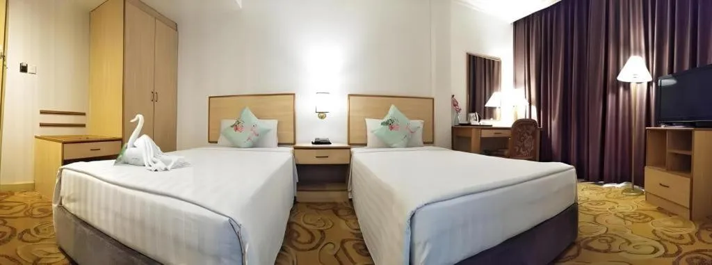 Bed in The Orchid Hotel