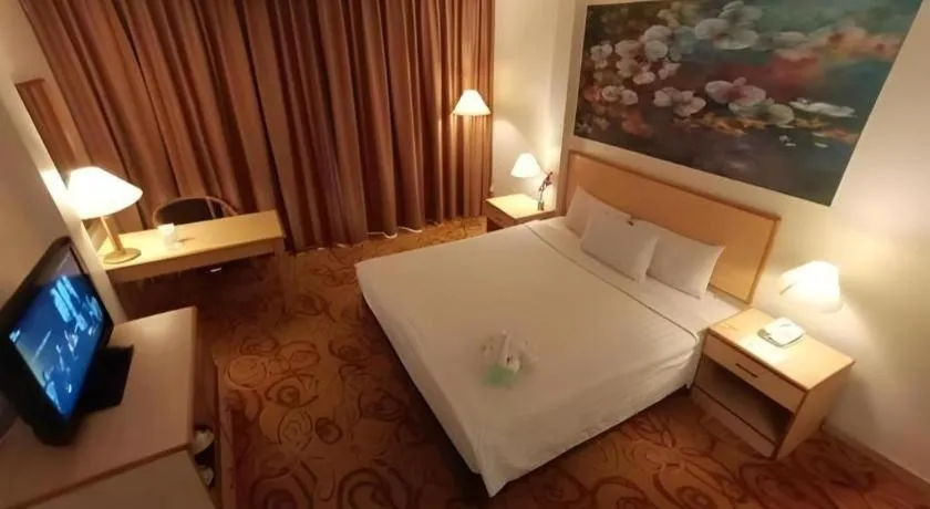 Bed in The Orchid Hotel