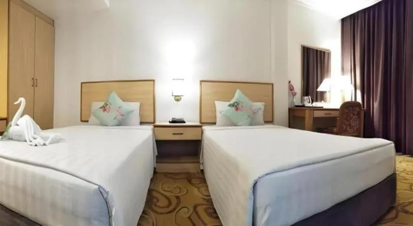 Bed in The Orchid Hotel