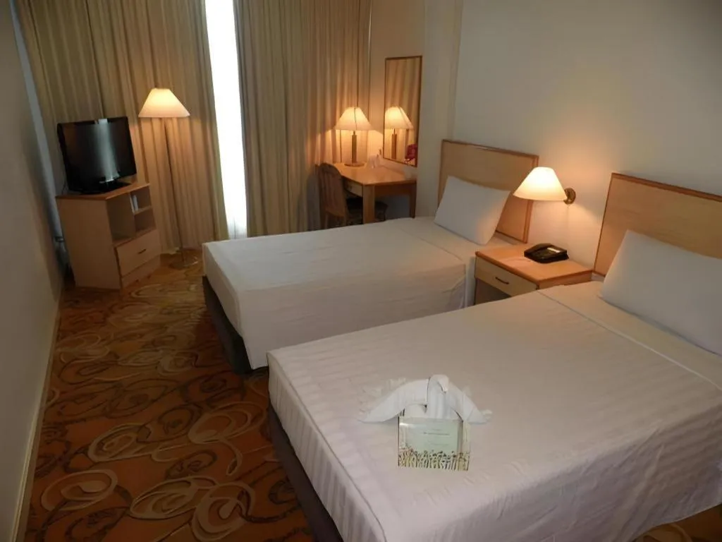 Bed in The Orchid Hotel