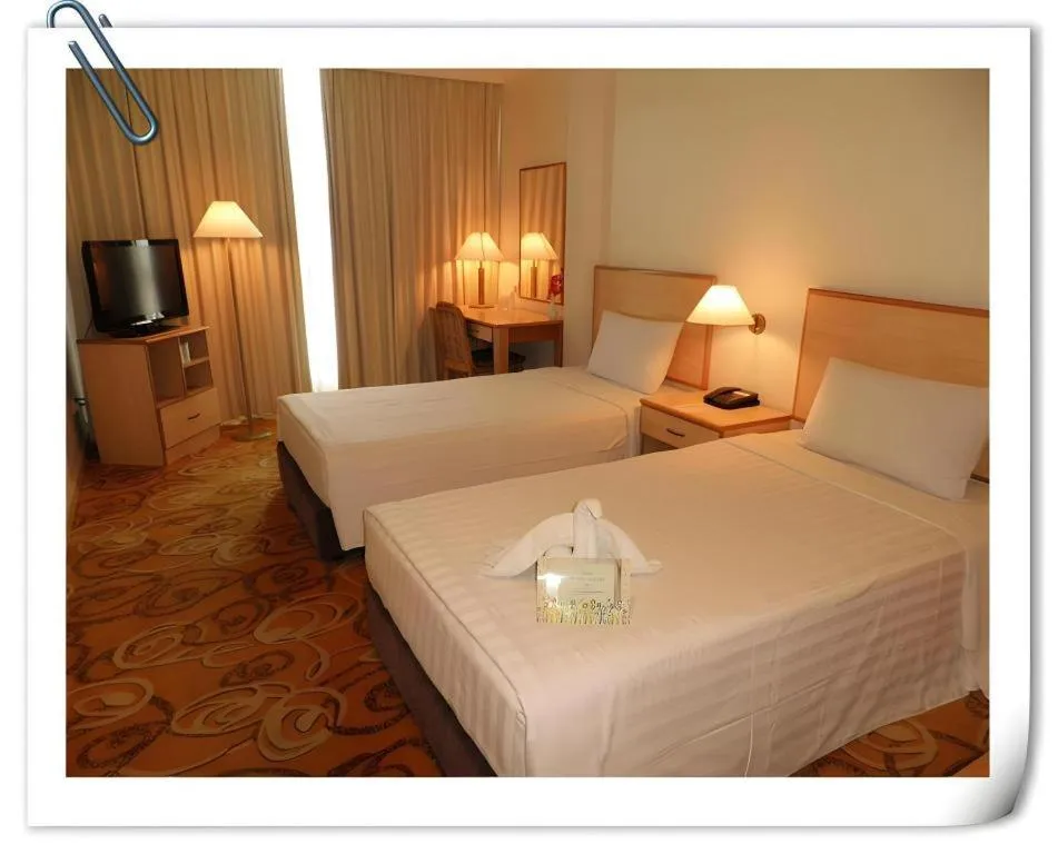 Bed in The Orchid Hotel