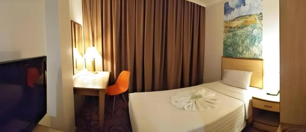 Bed in The Orchid Hotel