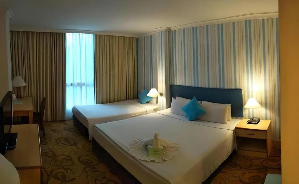 Bed in The Orchid Hotel