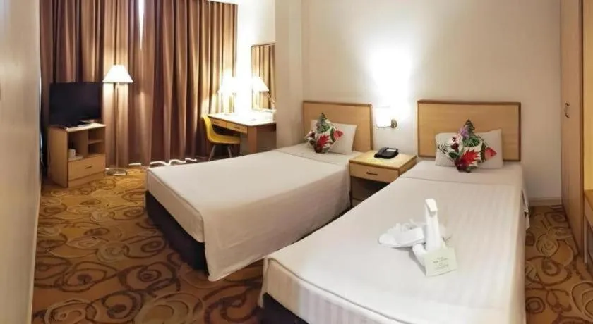 Bed in The Orchid Hotel