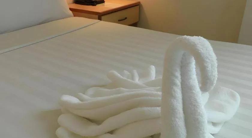 Bed in The Orchid Hotel