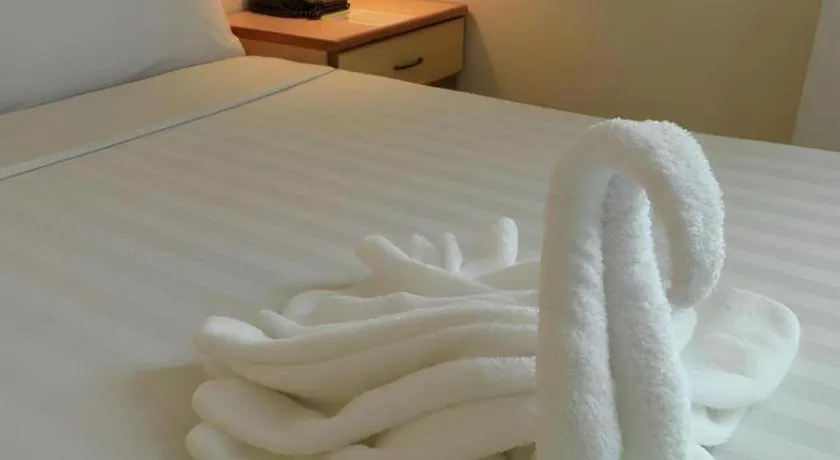 Bed in The Orchid Hotel