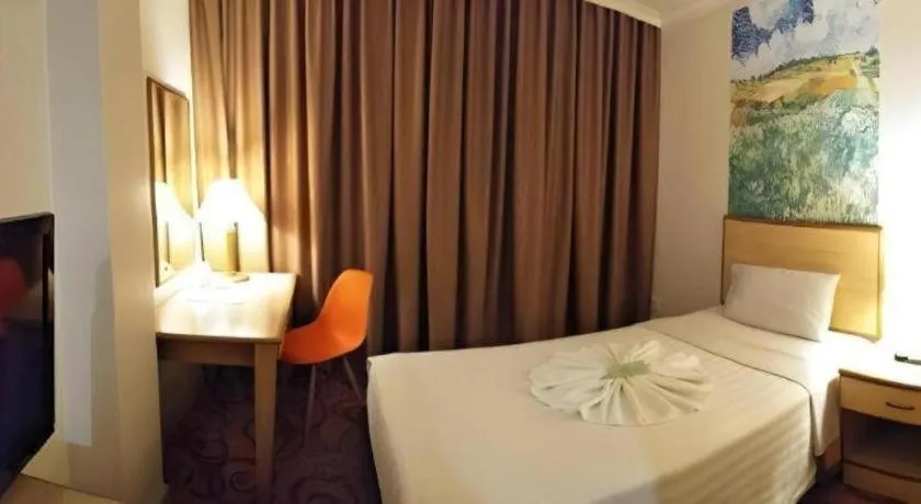 Bed in The Orchid Hotel