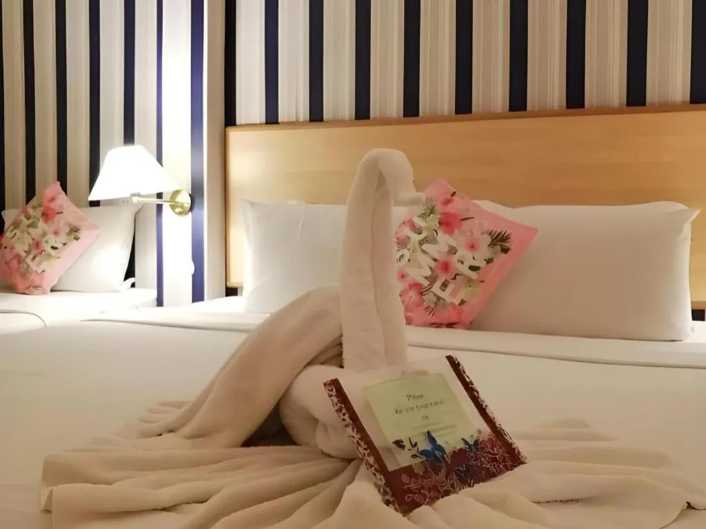 Bed in The Orchid Hotel