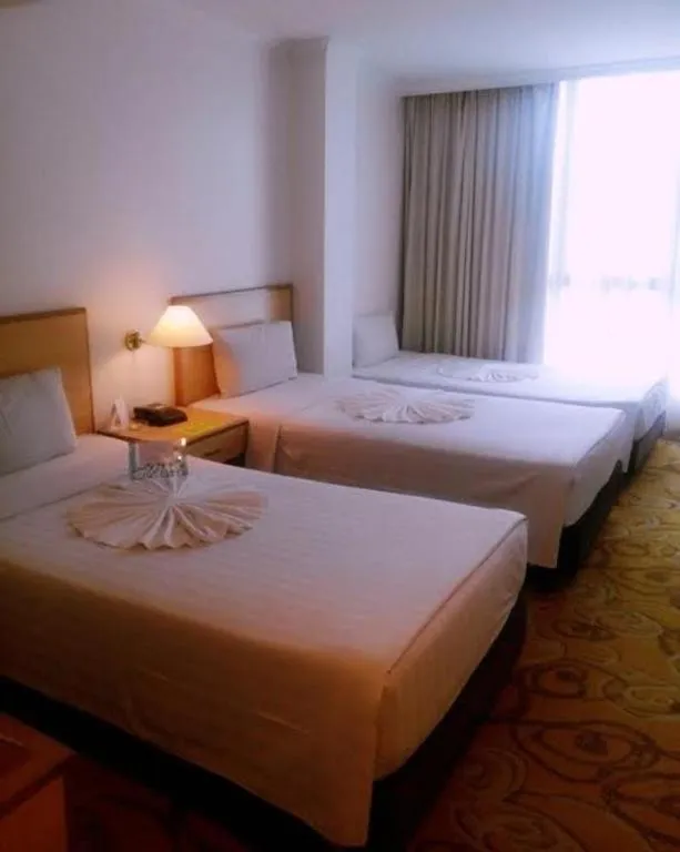 Bed in The Orchid Hotel