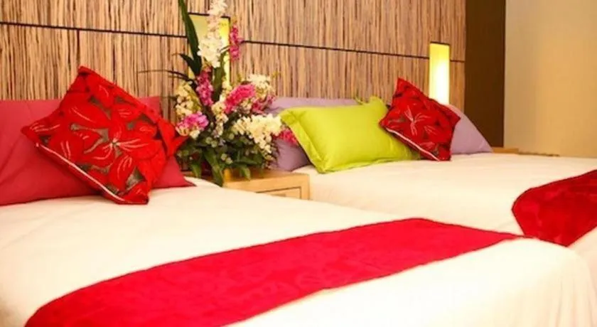 Bed in Grand Medallion Hotel