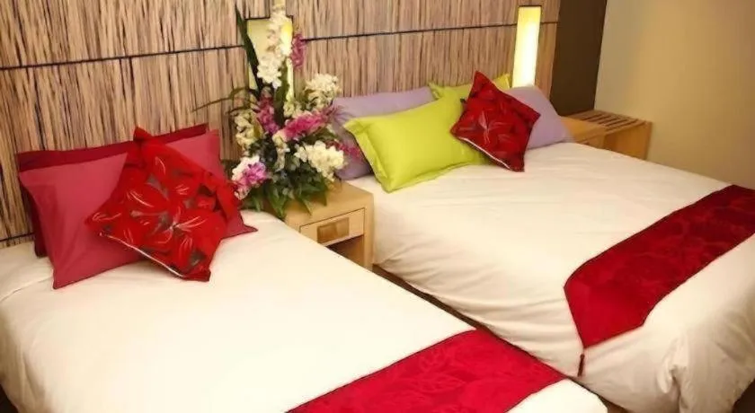 Bed in Grand Medallion Hotel