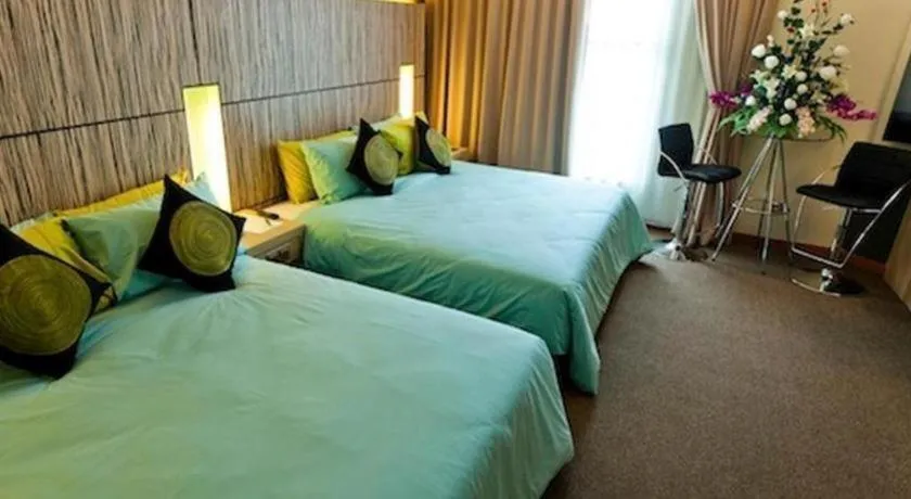 Bed in Grand Medallion Hotel