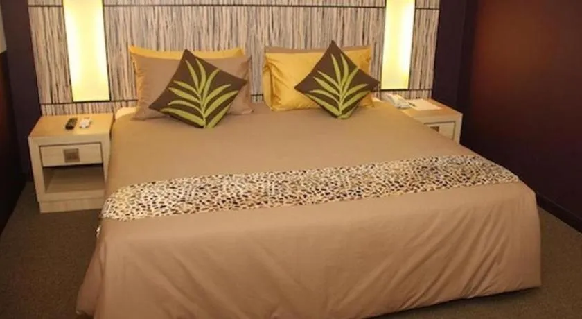 Bed in Grand Medallion Hotel