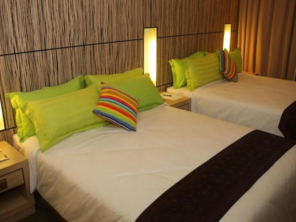 Bed in Grand Medallion Hotel