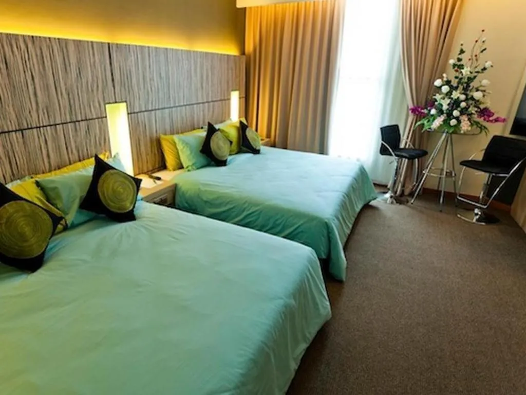 Bed in Grand Medallion Hotel