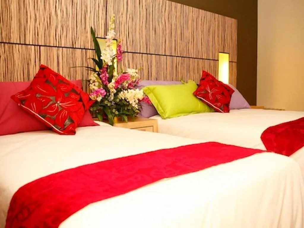 Bed in Grand Medallion Hotel