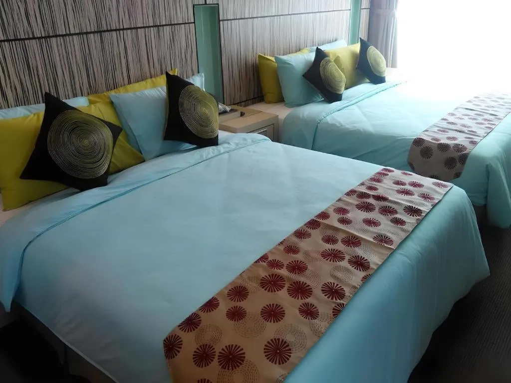 Bed in Grand Medallion Hotel