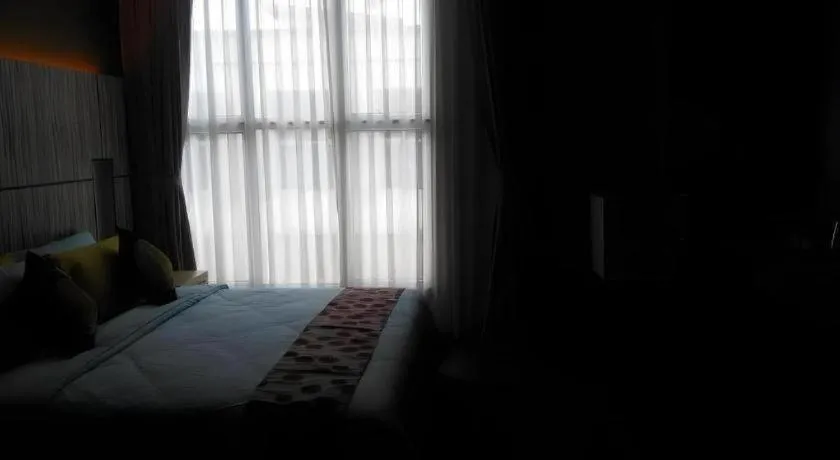 Bed in Grand Medallion Hotel