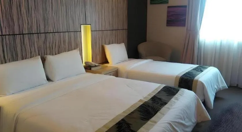 Bed in Grand Medallion Hotel