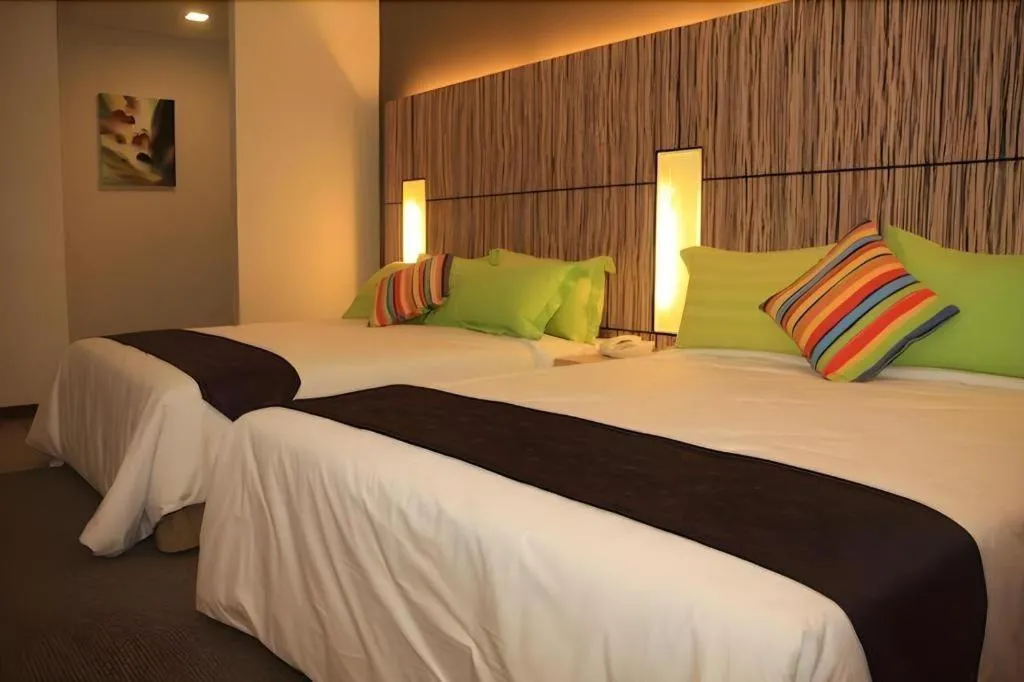 Bed in Grand Medallion Hotel