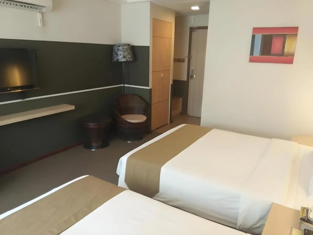 Bed in Grand Medallion Hotel