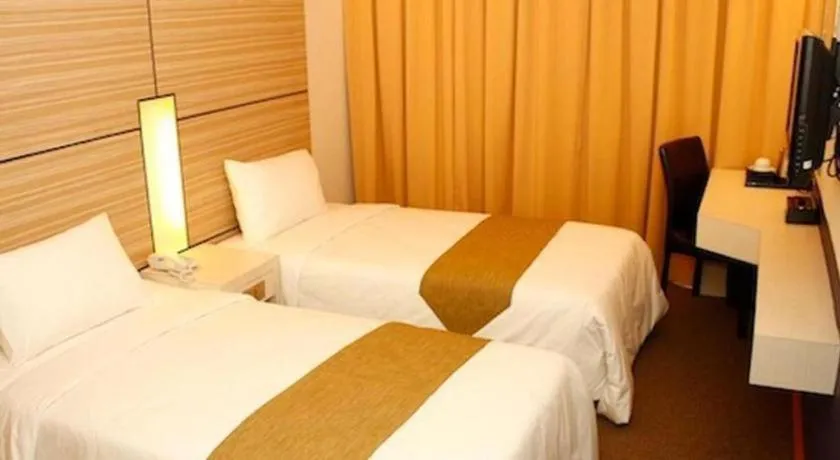 Bed in Grand Medallion Hotel