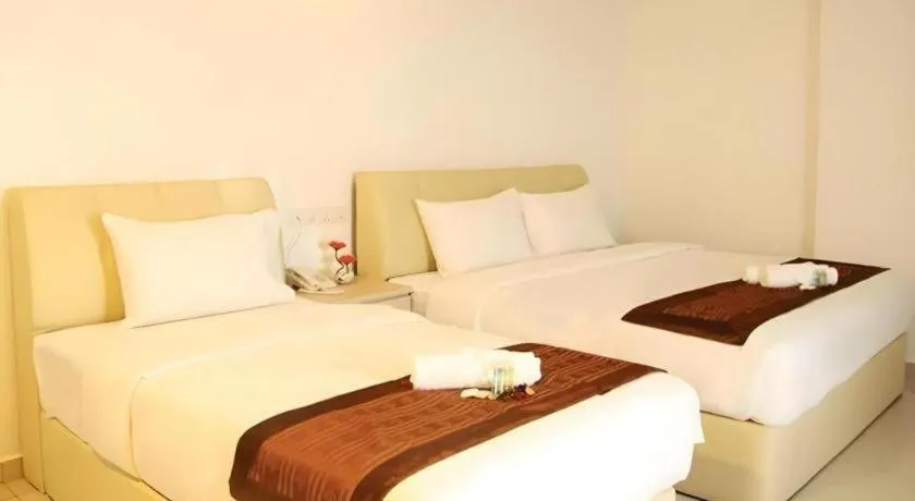 Bed in Peach Hill Hotel & Cafe