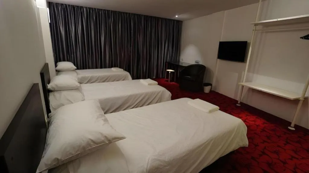 Bed in Riverine Garden Hotel