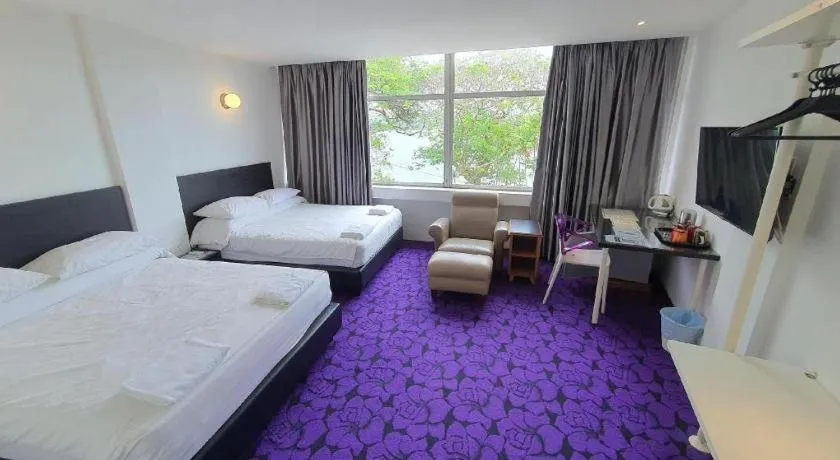 Bed in Riverine Garden Hotel