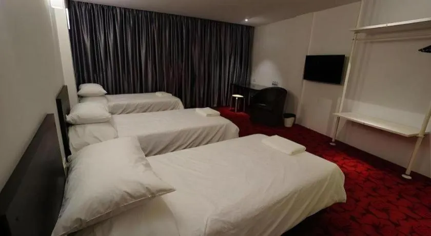 Bed in Riverine Garden Hotel