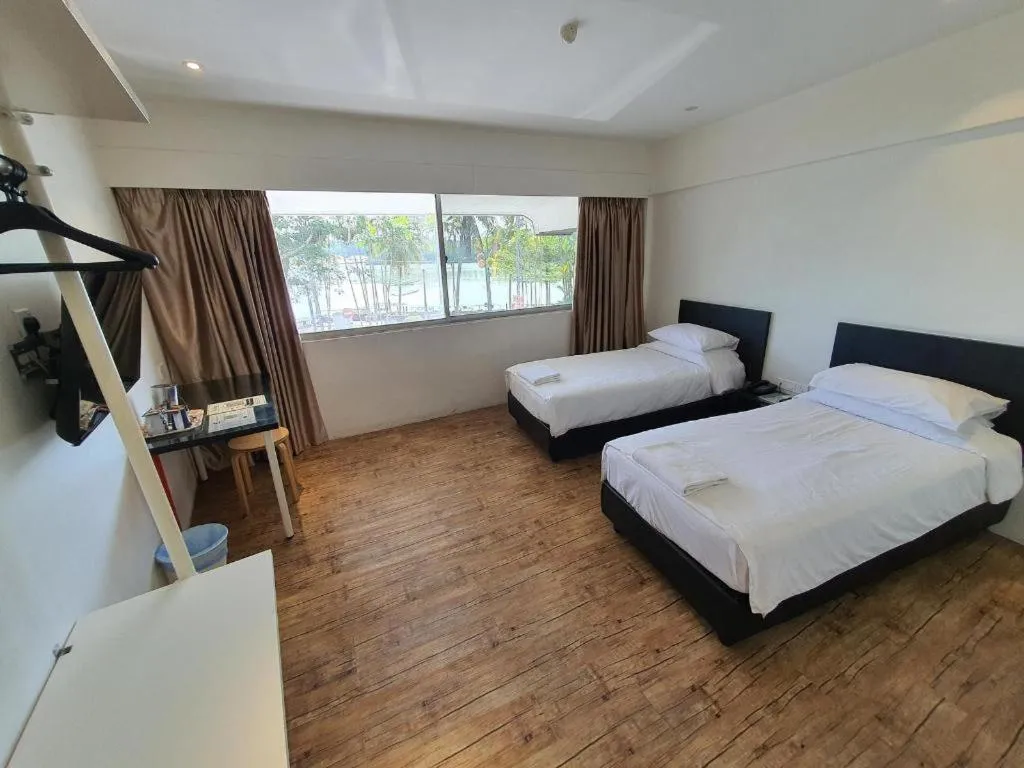 Bed in Riverine Garden Hotel