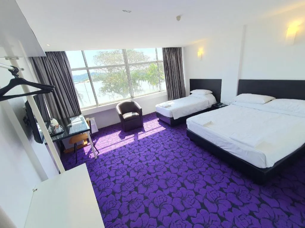 Bed in Riverine Garden Hotel